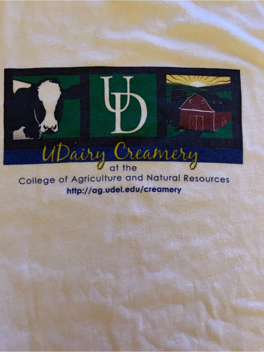 White T‑Shirt with Green Navy and Yellow UDairy Creamery Logo